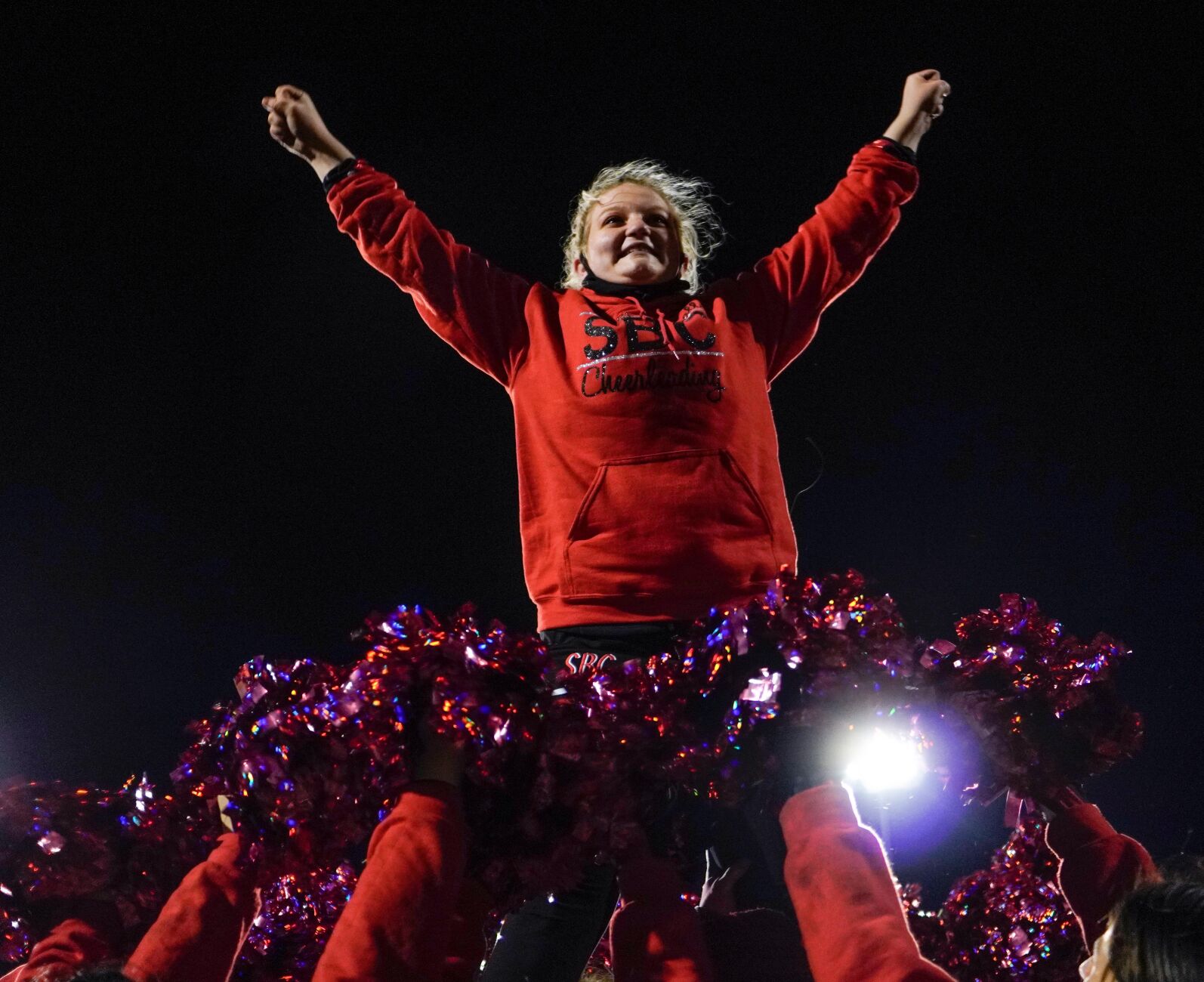 Southern Boone cheerleaders hold Hailey Fleming in the air